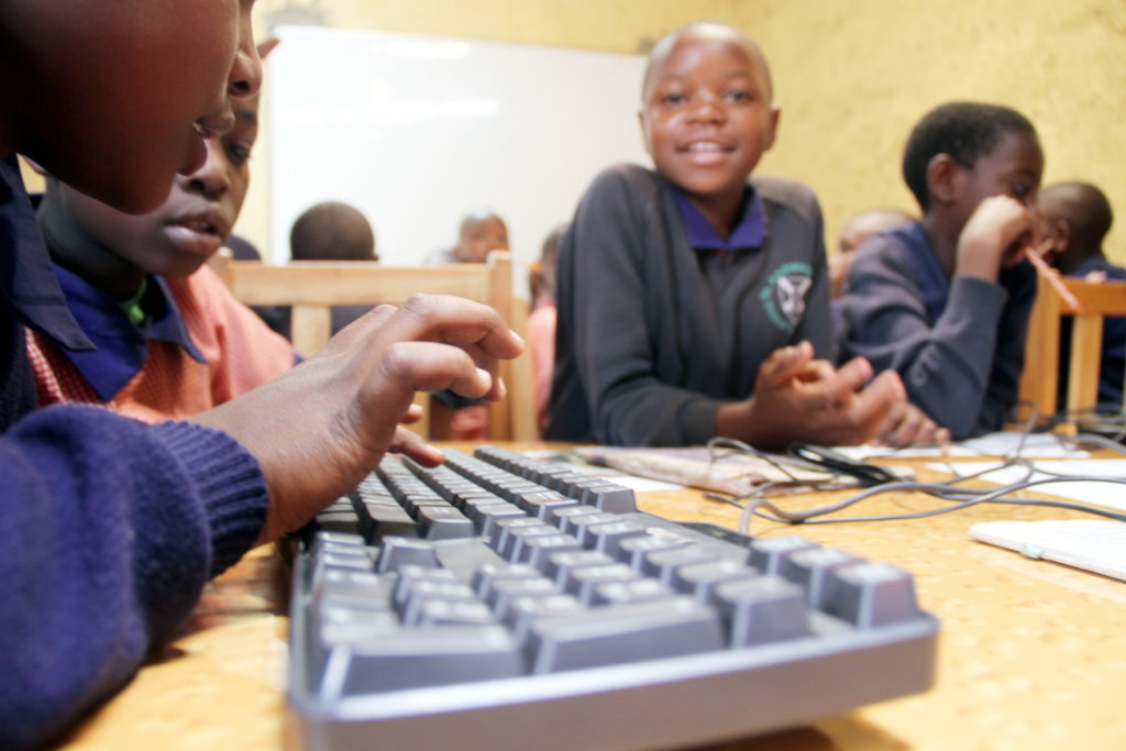 Student hands on a keyboard
